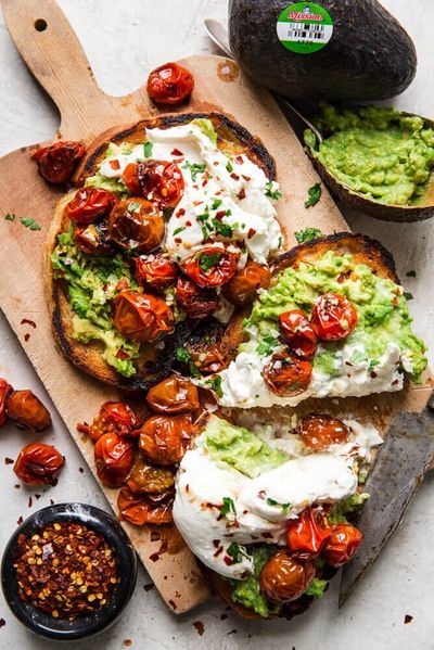 avocado toast with tomatoes and sour cream