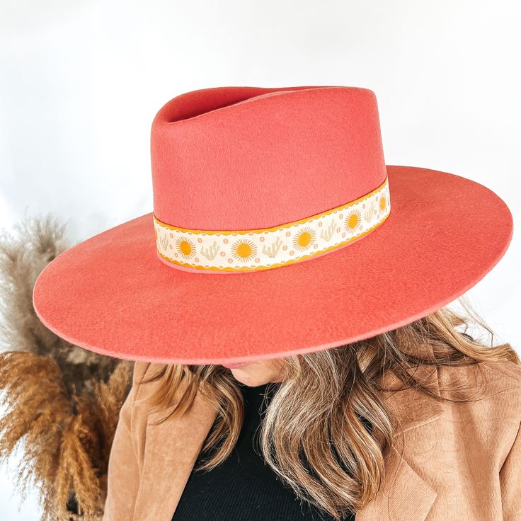 Model is wearing a coral pink with a sun and cactus hat band. Spring Fedora With Flat Crown, One Size Fits Most, Spring Fedora With Flat Crown, One Size, Retro Hat With Adjustable Flat Crown, Spring Fedora With Flat Crown, Trendy Spring Hat With Flat Crown, Trendy Flat Crown Hat For Spring, Retro Wide Brim Hat For Fall, Retro Wide Brim Fedora For Spring, Spring Retro Fedora With Curved Brim