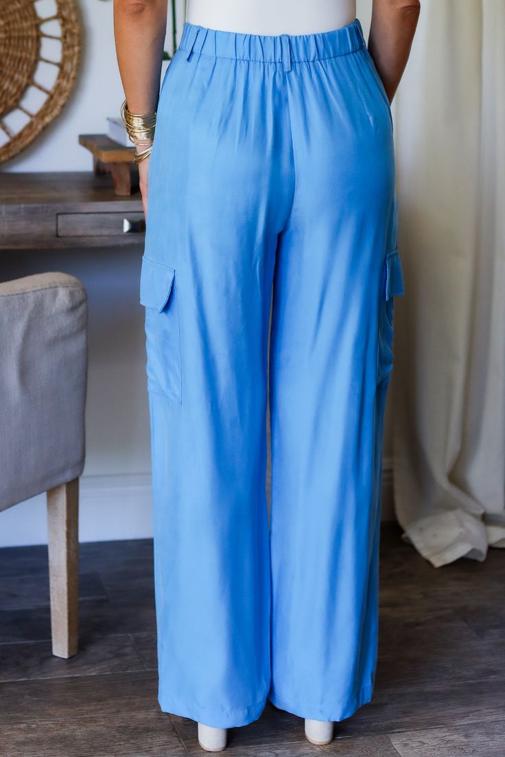 Get ready to strut your style this spring with our Laura cargo pants! With a gorgeous electric blue shade, these pants will add a pop of color to any outfit. Plus, their cargo design provides plenty of pockets for all your essentials. Step out in style and functionality with Laura! 100% Rayon Color: Flat Blue with Shimmer Button/ Zipper Closure Multi Pockets Half Elastic Waist BAND Light Weight Utility Cargo Style Straight Leg Belt Loops True to size Model is wearing a size Small. She is 5'6". 1 Casual Blue Full-length Cargo Pants, Light Blue Full-length Pants With Pockets, Light Blue Full Length Pants With Pockets, Blue Relaxed Fit Cargo Jeans With Pockets, Blue Mid-rise Cargo Pants With Pockets, Mid-rise Blue Cargo Pants With Pockets, Blue Straight Leg Pants With Flap Pockets, Casual Blue Pants With Cargo Pockets, Casual Blue Pants With Flap Pockets