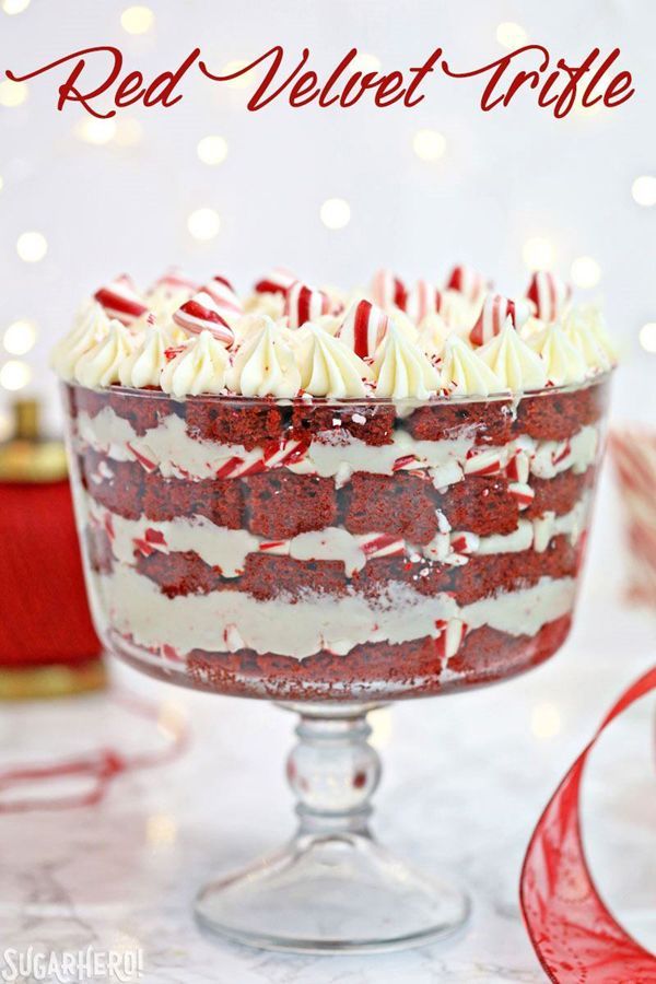 a red velvet trifle with white frosting and candy canes