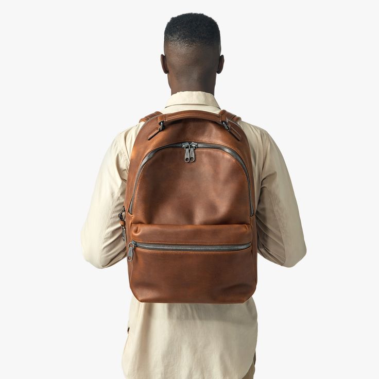 The Runwell Backpack Modern Brown Leather Backpack For Everyday Carry, Modern Brown Leather Backpack For Everyday, Modern Brown Leather Backpack, Modern Leather Satchel Backpack With Leather Lining, Luxury Waxed Leather Backpack For Everyday Use, Modern Brown Backpack For Everyday Carry, Luxury Leather Backpack For Everyday, Leather Backpack For Commuting, Leather Backpack With Gunmetal Hardware