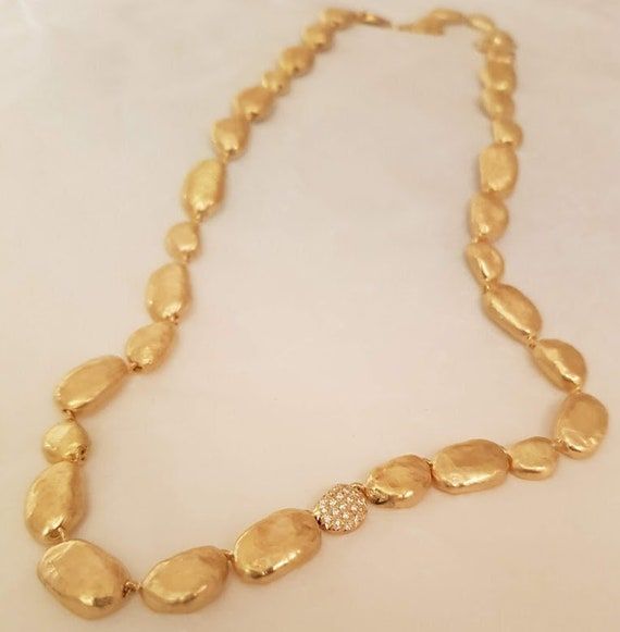 #goldbeannecklace #14kgoldbracelet #pebblesnecklace #luxuryjewelry #finejewlery #diamondnecklace #chunkygoldnecklace #necklacesforwomen #smalldiamonds #goldbeadsnecklace #goldnuggetchain #uniquegoldnecklace #engagementjewelry #goldjewelry Unique Gold Necklace, Bean Necklace, Fine Jewlery, Wide Wedding Rings, Chunky Gold Necklaces, Pebble Necklace, Beautiful Wedding Bands, Gold Bead Necklace, Gold Engraving