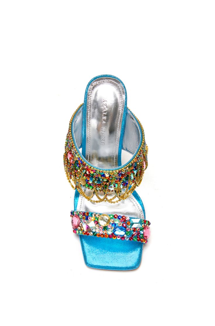 **FINAL SALE - NO EXCHANGES OR RETURNS** Our Envie stiletto mules are the perfect luxurious statement shoe. These feature an open toe and square cut silhouette made with a blue fabrication and colorful rhinestone embellishments all over the shoe. The front strap also includes gold chain accents draping down the shoe. These beautiful shoes would be perfect styled for a going out look! Heel Height: 4.75" Sandal Platform, Statement Shoe, Stiletto Sandals, Square Cut, Blue Sandals, Plus Size Shopping, Boots And Sneakers, Platform Boots, Denim Outfit