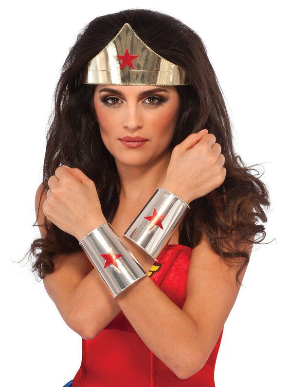 a woman wearing a wonder costume with her arms crossed