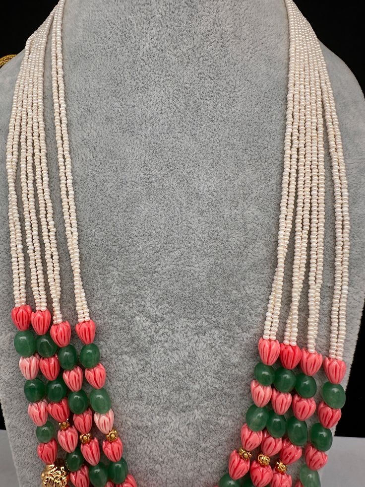 Coral Emerald Nakshi Multi Layer Necklace Only Neckalce no earringsColor : GoldenSize : Necklace Length : 22 Inches Approx;Stones : Pearl Real Emeralds Tulip Beads and Nakshi Balls Traditional Handmade Pink Beads, Traditional Multi-strand Jewelry With Dangling Beads, Multicolor Gemstone Bead Necklaces For Festive Occasions, Festive Multicolor Gemstone Bead Necklaces, Traditional Multi-strand Gemstone Bead Jewelry, Traditional Green Multi-strand Beads, Traditional Multi-strand Beaded Necklace For Wedding, Traditional Green Long Necklace Beads, Handmade White Beads For Festive Season