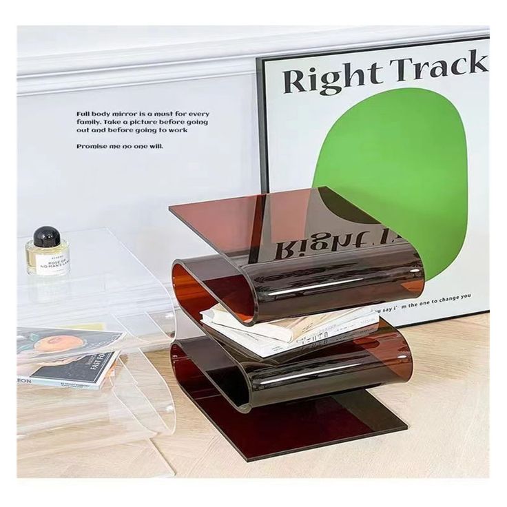 there are three different pieces of furniture on the table and in front of it is a sign that says right track