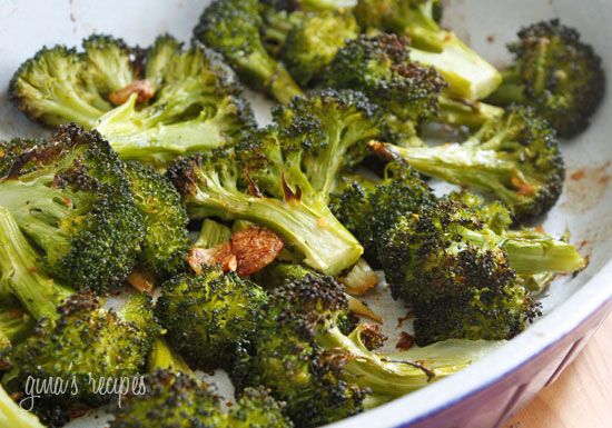 cooked broccoli florets in a white bowl