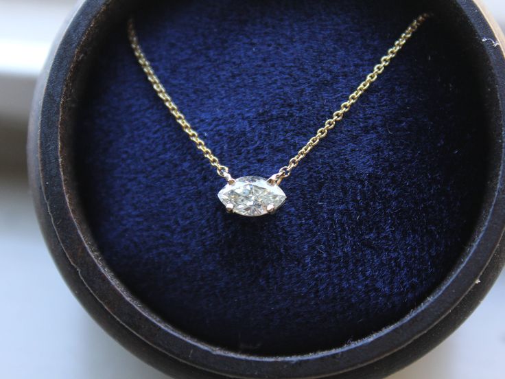 "This 14k gold necklace four prong setting features a 7X4 mm Marquise diamond, its minimalist design makes it a perfect option for an everyday sparkling look. This necklace will be delivered in a beautiful handmade wood box. * Handmade in the USA. * Gold KT: 14K gold. * Diamond: Marquise Cut Diamond 7x4 mm (approximately .40 carat). * Chain type: 1 mm cable chain, lobster clasp. * Diamond Details: I/SI2 or better. * Chain length: 16\" (longer and shorter lenghts available upon request). * Settin Classic Marquise Single Diamond Necklace, Formal Solitaire Marquise Diamond Necklace, Formal Marquise Solitaire Diamond Necklace, Classic Marquise Solitaire Necklace In Diamond White, Formal Single Diamond Marquise Cut Necklace, Formal Gold Marquise Solitaire Necklace, Gold Marquise Solitaire Necklace For Formal Occasions, Classic Solitaire Marquise Necklace, Classic Marquise Yellow Gold Diamond Necklace