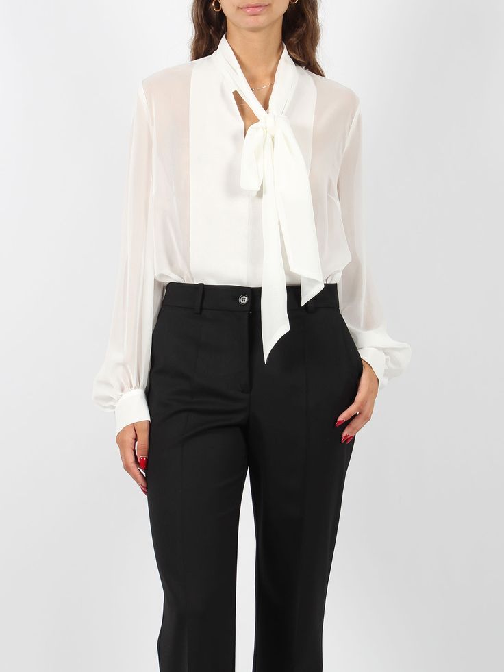 P. A. R. O. S. H Polodori blouse, with semi-transparent crepe effect. - FW24 - V-neck with bow - Pleated details - Long sleeves with gathered hem - Cuff with button - Made in Italy - 100% Polyester Elegant V-neck Blouse With Sheer Sleeves, Elegant V-neck Top With Bow, Classic Office Tops With Sheer Sleeves, Classic Sheer Sleeve Tops For Office, Silk Workwear Blouse With Bow, Silk Top With Bow For Workwear, Silk Tops With Bow For Workwear, Silk Workwear Top With Bow, Silk Blouse With Sheer Sleeves For Work