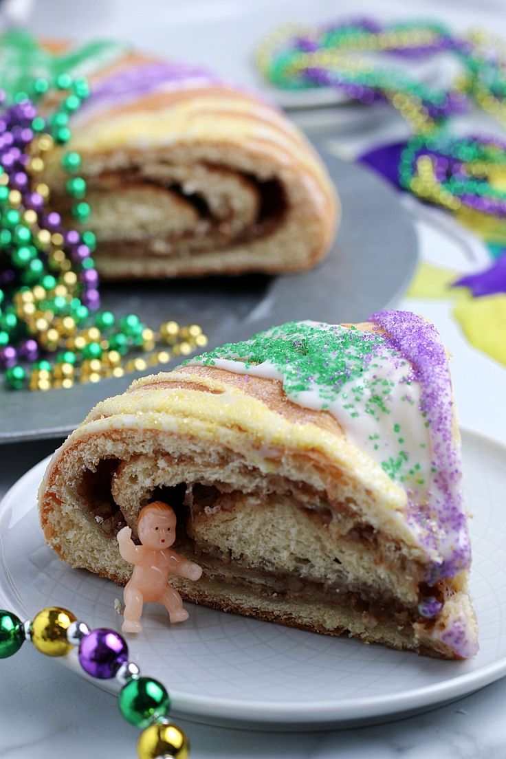 there is a small figurine in the middle of a cake roll on a plate