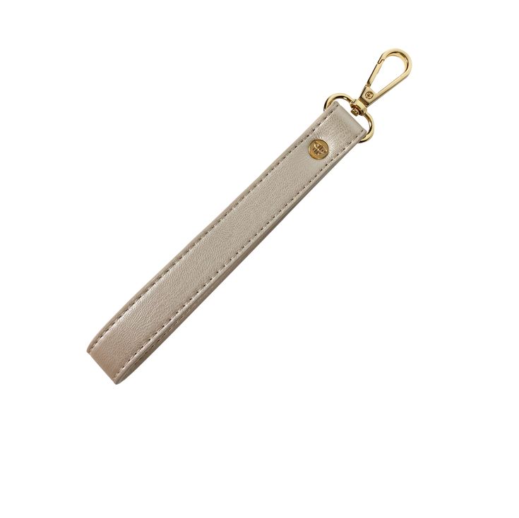 a keychain with a white leather strap and gold metal clasp on an isolated background