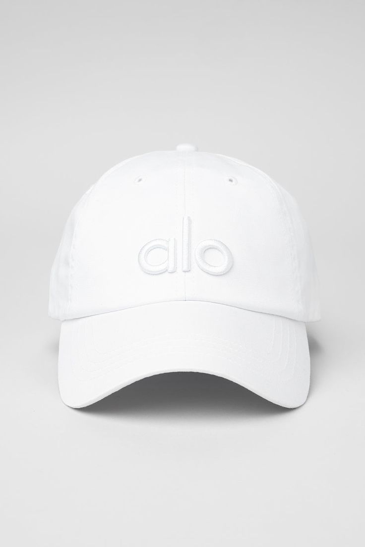 a white baseball cap with the word'o on it, in front of a gray background