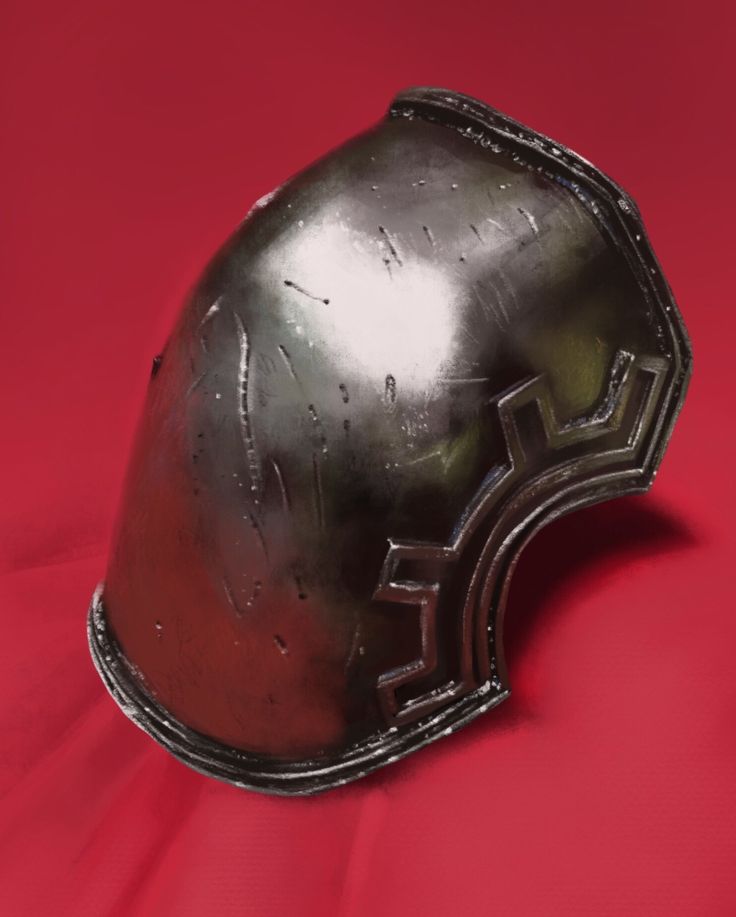 an old helmet is sitting on a red surface