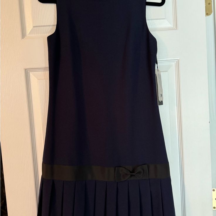 Nwt, Navy Blue Mid Length Dress With Pleats And Bow. Gold Back Zipper Navy A-line Dress For Formal Occasions, Classic Blue A-line Dress, Classic Blue Dress For Evening, Elegant Navy Pleated Dress, Spring Formal Navy Dress, Classic Blue Evening Dress, Navy Formal Dress For Spring, Formal Navy Dress For Spring, Classic Navy A-line Dress