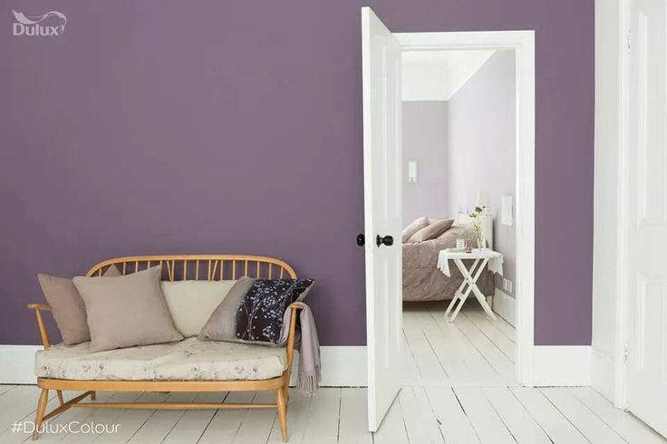 a living room with white floors and gray walls