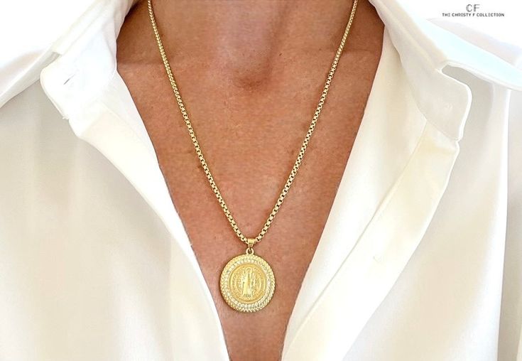 A blessing to wear, this gold filled medallion of Mother Mary worn on a gold filled interlocking chain comes together to create the most holy and heavenly of pieces. 21 inches with a 1 inch extender Spiritual 14k Gold Coin Necklace, Gold Chain Medallion Necklace As Gift, Gold Chain Medallion Necklace, Gold Plated Medallion Necklace With Round Pendant, Gold-plated Medallion Necklace With Round Pendant, Gold-plated Round Medallion Necklace With Gold Chain, Gold Plated Yellow Gold Medallion Necklace, Spiritual Yellow Gold Medallion Necklace With Large Pendant, Gold Round Pendant With Miraculous Medal