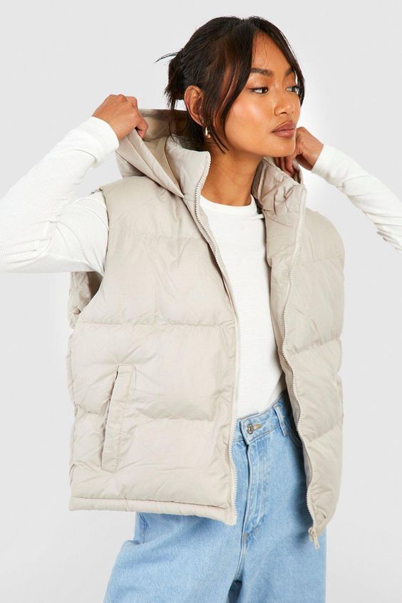 Womens Hooded Vest - Beige - 10 - Add a different type of layer to your look with this vest, a sporty and stylish piece. This sleeveless jacket closely resembles a waistcoat and is perfect for throwing over long sleeve tops, sweaters, and lightweight coats. This body warmer can add that much-needed extra insulation to your outfit during colder months without making you feel too bulky. Style this women's vest with a sports outfit, work attire, or everyday look.Style: GiletFabric: PolyesterNecklin Sleeveless Jacket Outfit, Jacket Without Sleeves, Womens Hooded Vest, Waistcoat Designs, Hooded Gilet, Faux Fur Gilet, Sports Outfit, Fur Gilet, Outfit Work