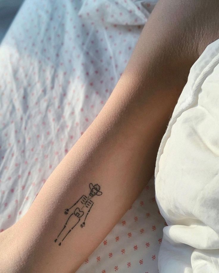 a woman's arm with a tattoo on it that has a dog in the middle