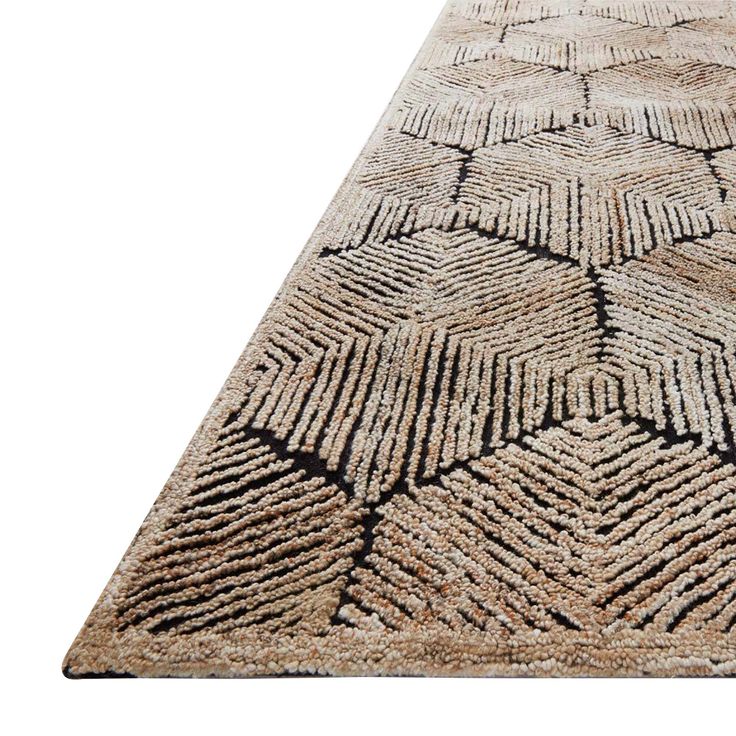 a large rug with an intricate design on the top and bottom, in beige tones