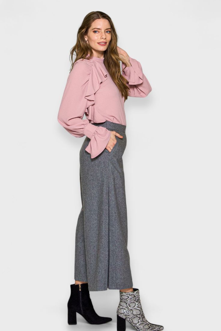 Expertly crafted in Italy from reclaimed wool, the Milan Gray Wide-Leg Pants offer both style and sustainability. The wide-leg culotte design boasts two side pleats and convenient side pockets, perfect for any fashion-forward individual. For a sleek and sophisticated outfit, pair these pants with our Mona blouse or elevate your look with our Anna Ruffled blouse and Ronan boots. Embrace a more mindful and luxurious wardrobe with these stunning pants. Handcrafted in Italy by Marisé Eco. Couture Co Grey Pants Outfit, Luxurious Wardrobe, Ruffled Blouse, Plus Size Designers, Dress Gift, Grey Pants, Denim Coat, Clothes Collection, Wool Fabric