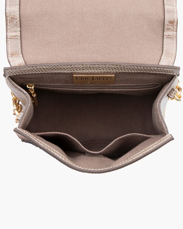 A compact, semi-structured flap pouch of embossed calf leather holds more than you realize and takes you seamlessly from day into evening. Multiple handle options make Livia one of the most versatile women's crossbody bags for sale online. The faceted gold-tone chain link top handle either dangles as ornamentation when the crossbody strap is in use, or if you prefer, detaches altogether. The long leather strap adjusts from shoulder to crossbody length by use of a belt buckle. Outer pocket on rev Luxury Rectangular Flap Bag With Chain Strap, Luxury Flap Bag With Chain Strap For Daily Use, Luxury Gold Flap Bag With Chain Strap, Timeless Rectangular Flap Bag With Chain Strap, Everyday Luxury Clutch Flap Bag, Luxury Crossbody Box Bag With Chain Strap, Everyday Luxury Gold Rectangular Flap Bag, Gold Rectangular Flap Bag For Everyday Luxury, Rectangular Gold Flap Bag For Everyday Luxury