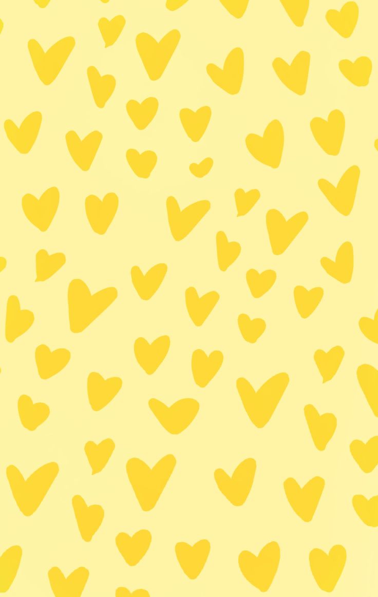 a yellow background with small hearts on it