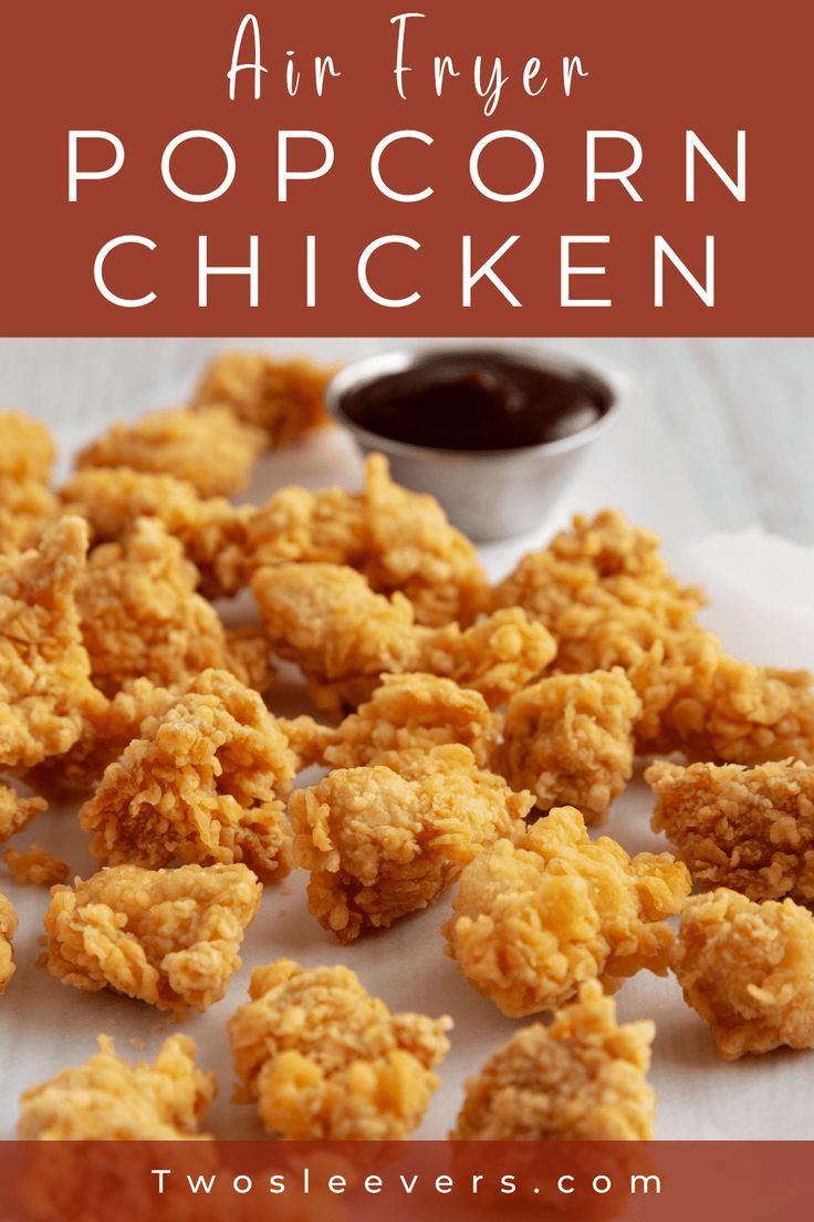 air fryer popcorn chicken on a white plate with dipping sauce in the middle and text overlay that says air fryer popcorn chicken