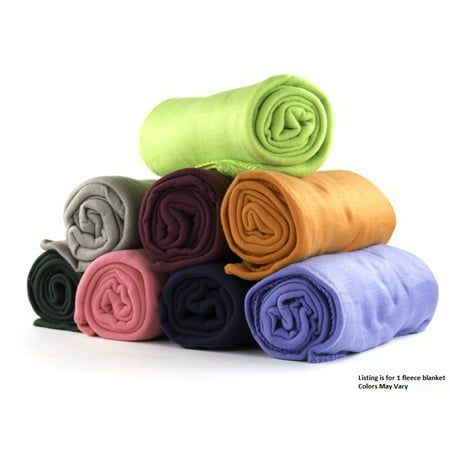 several colors of towels stacked on top of each other in different shapes and sizes, with one folded up to the side