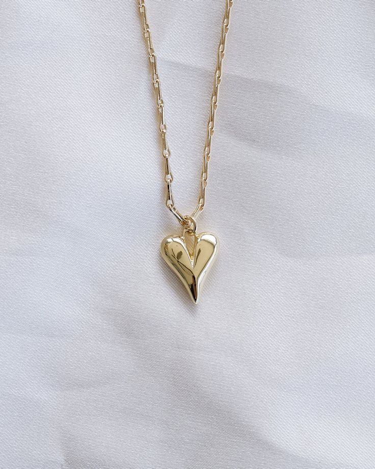 Show your love with this gorgeous Puffy Heart Necklace! Crafted in luxurious gold, this eye-catching necklace adds the perfect touch of romance to your look. For a heartfelt gift or an expression of your own affection, you can't go wrong with this stunning piece! NECKLACE FEATURES Material: Brass 24K Gold Filled Chain Width: Approx. 1.5mm Chain Style: Barleycorn Designed Chain Lead Free, Nickel Free Puffy Heart Necklace, Freshwater Pearls Earrings, Puffy Heart, Pretty Earrings, Moonstone Ring, Heartfelt Gifts, Opal Necklace, Delicate Necklace, Jewelry Packaging