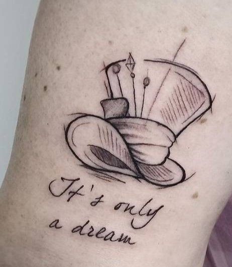 a woman's thigh with a tattoo saying if it's only a dream