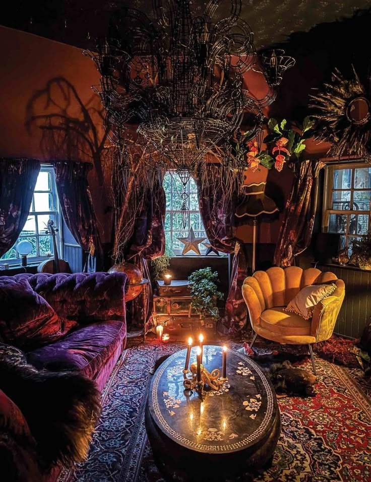 a living room filled with furniture and a chandelier hanging over it's head