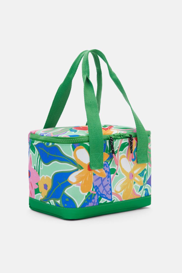 a colorful floral lunch bag with green handles