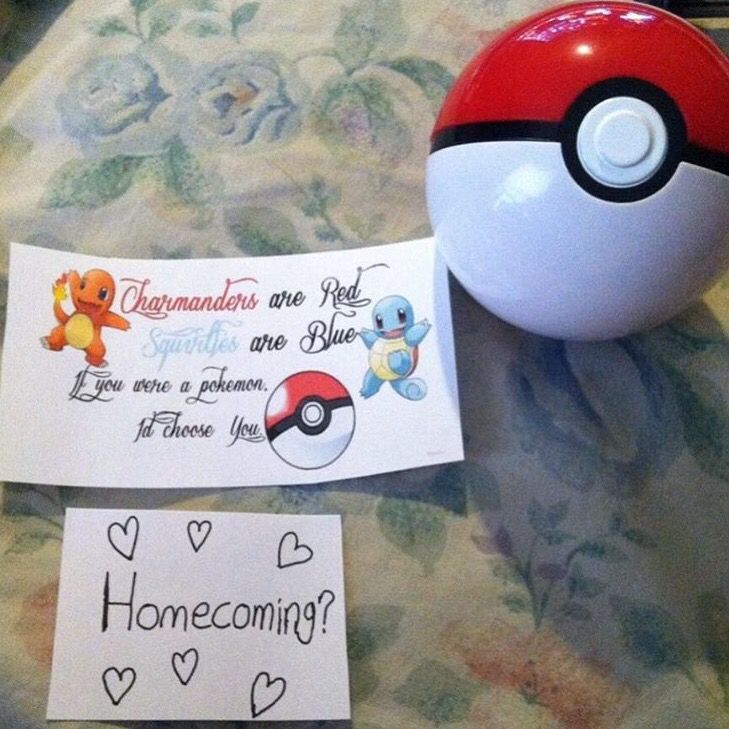 a pokemon ball and stickers are on the table next to a note that says, home coming?