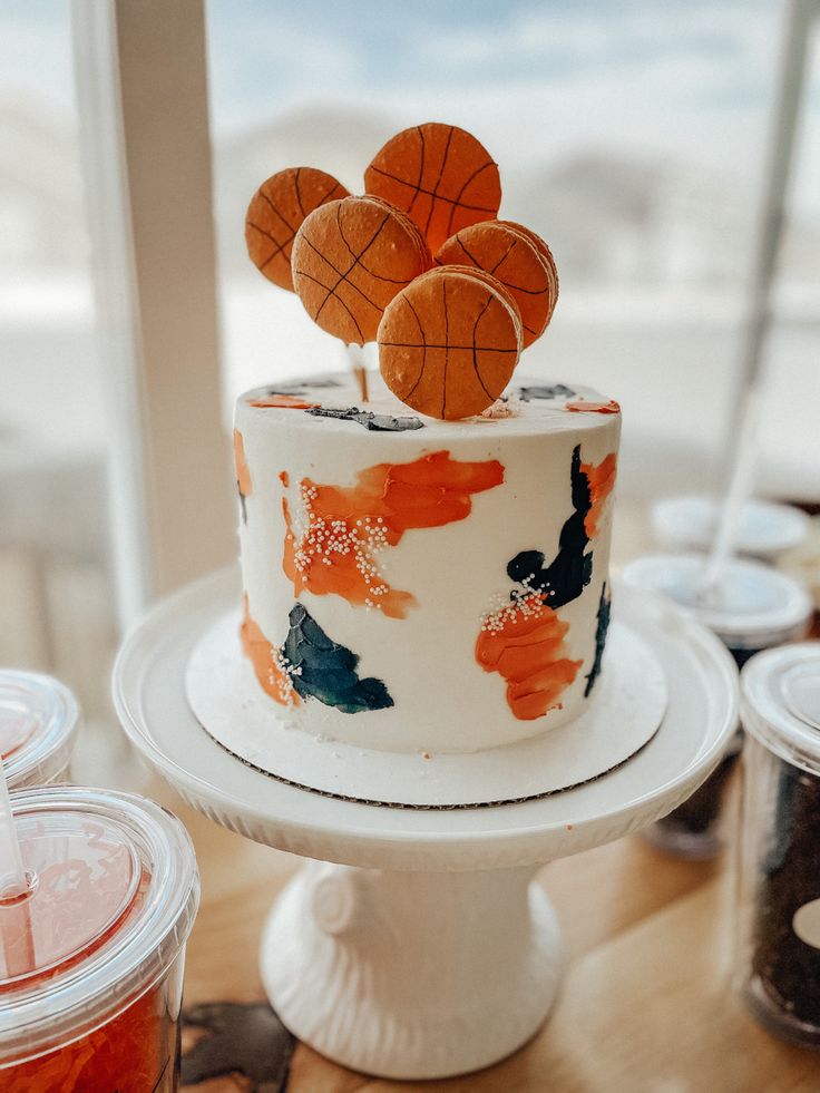 there is a cake decorated with basketballs on top