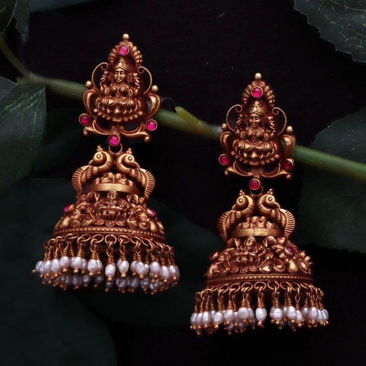 Enhance your grace and beauty with our exclusive antique collection from Pothys Swarna. From timeless neckpiece to statement jhumkas we have it all at our Chennai and Nellai showrooms, come visit us soon! #PothysSwarnaMahal #antiquecollection #bridaljewellery #bridesofindia #antiquejewellery #weddingjewellery #goldjewellery #goldweddingjewellery #bridal #goldjewelry Antique Lakshmi Earrings, Gold Antique Jhumkas, Temple Jhumkas Earrings, Bridal Jumka Design, Jhumka Designs Antiques, Antique Jhumkas Gold Temple Jewellery, Antique Jumka Design Gold, Gold Jumkas Antiques, Antique Earrings Jhumka