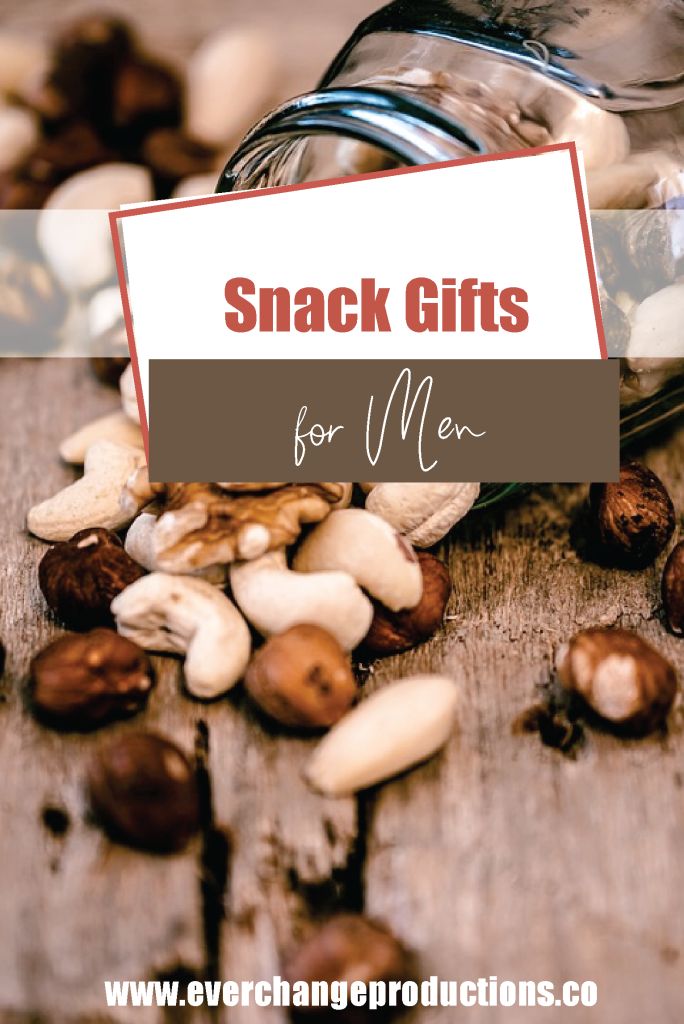 a jar filled with nuts sitting on top of a wooden table next to a sign that says snack gifts for men