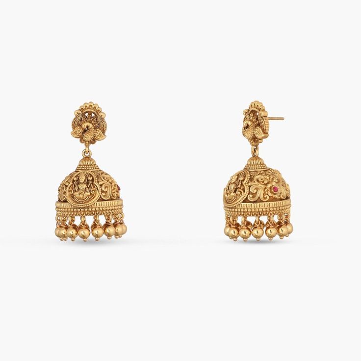 Description: This pair of Nakshi jhumkas exudes divine elegance, featuring the revered Goddess Lakshmi intricately crafted at the center. The detailed Nakshi work enhances the sacred design, making these jhumkas a timeless symbol of grace and tradition. Perfect for adding a touch of spiritual charm to your traditional ensemble, these jhumkas are both a statement of devotion and refined artistry. Product Information: Materials used: 925 Silver with Antique Gold Plating Stones: High Grade CZ Stone Ceremonial Jhumkas For Diwali, Ornate Heavy Jhumkas, Heavy Ornate Jhumkas, Traditional Chandbalis With Intricate Design For Festive Occasions, Traditional Festive Chandbalis With Intricate Design, Festive Traditional Chandbalis With Intricate Design, Temple Jewelry Jhumkas With Tilla For Rituals, Navratri Temple Jewelry Chandbalis With Intricate Design, Ornate Filigree Chandbali Jhumkas