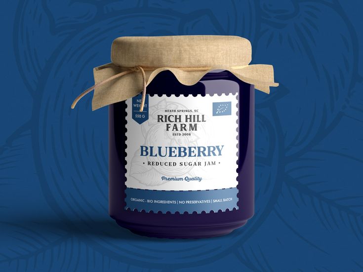 a jar of blueberry jam on a blue background