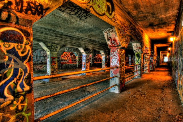 an abandoned building with graffiti all over the walls