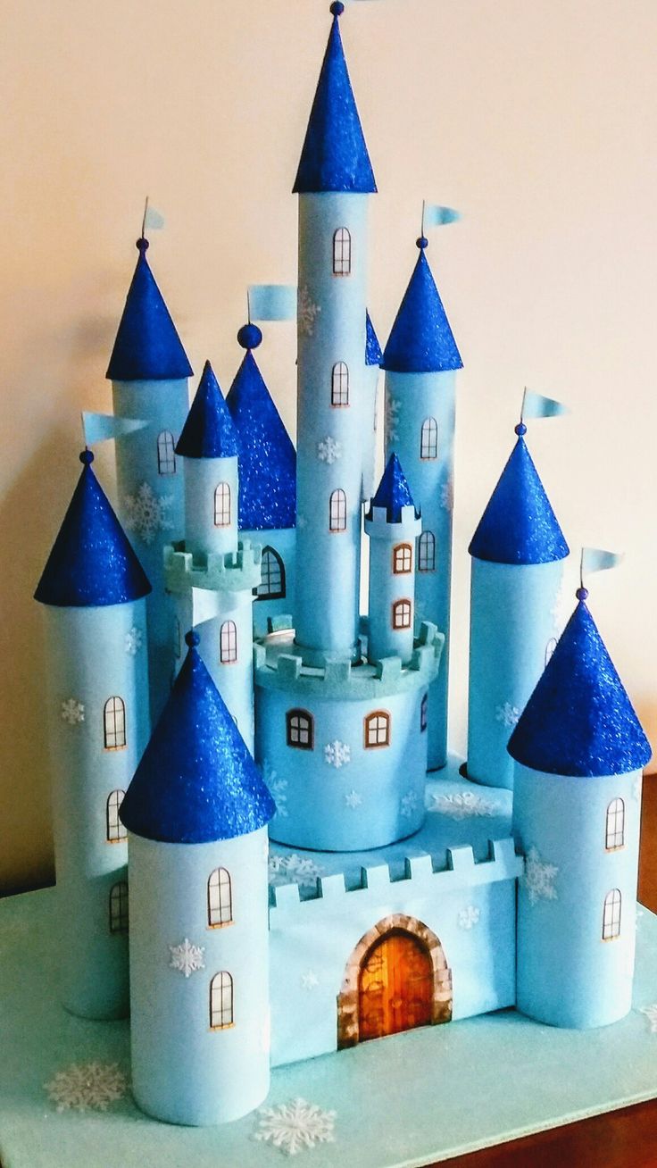 a castle made out of paper with snowflakes on it