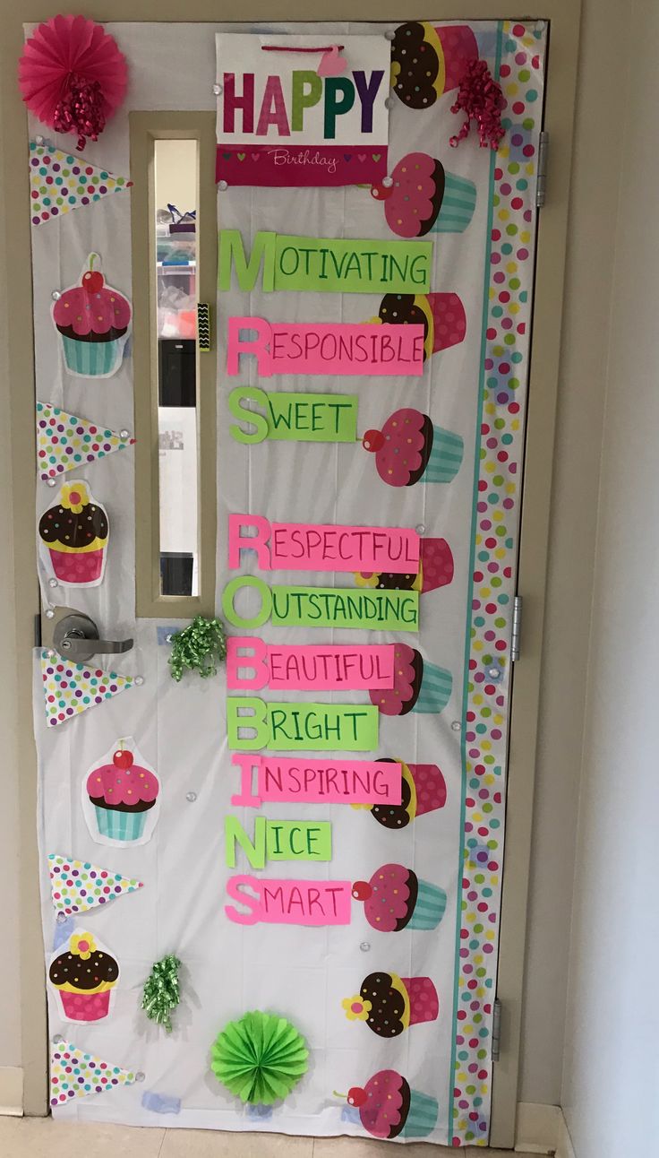 a door decorated with cupcakes and happy words