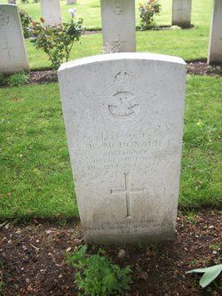 the headstones of two men and one woman in a cemetery