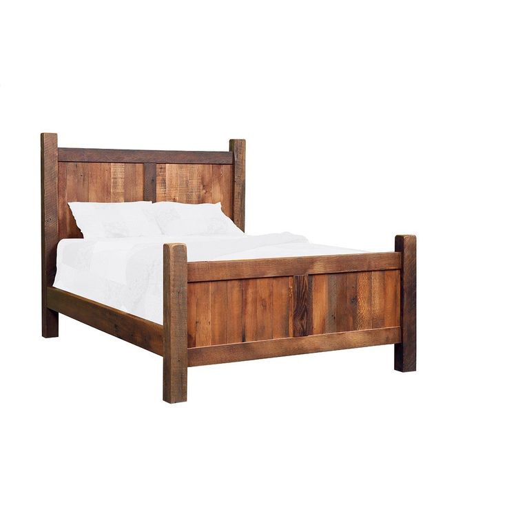 a bed frame made out of wood with white sheets and pillows on the headboard