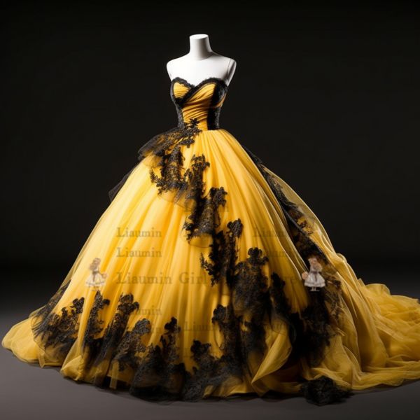 a yellow and black dress with flowers on the skirt is displayed in front of a mannequin