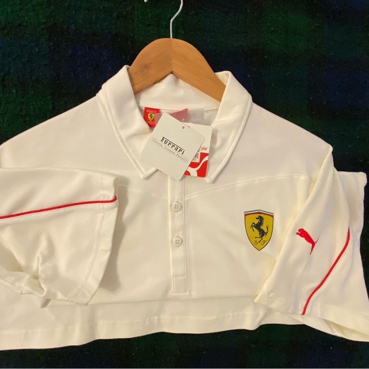 World Famous Ferrari Polo Shirt By Puma, New With Tags Men’s Size 8 A Beautiful Sports Shirt Iconic Ferrari Label Casual Long Sleeve Sports Polo Shirt, White Polo Collar Top For Sports Season, White Polo Collar Top For Sports, White Collared Top For Sports Events, Casual White Golf Tops, Sporty Golf Tops With Logo Print, White Polo Collar Sports Top, White Long Sleeve Golf Tops, Ferrari Polo Shirt