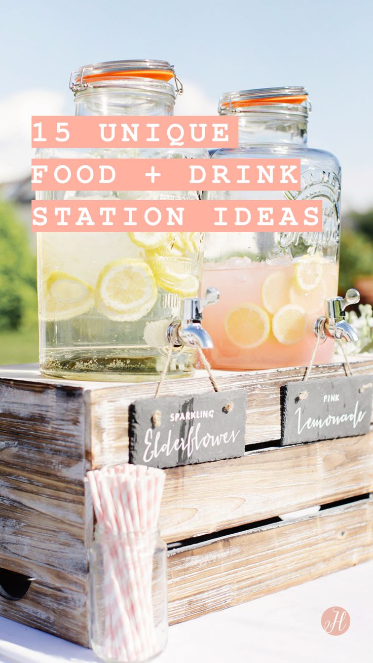 a wooden crate filled with drinks and lemonade on top of a white tablecloth