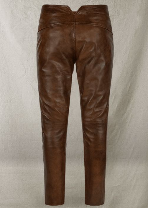 Men's Distressed Leather Pant In Dark Brown Embrace the rugged elegance of our men's distressed leather pant in dark brown. Meticulously crafted from durable cowhide with a semi-aniline finish, these biker jeans are designed to stand the test of time. The unique front straps add an edgy twist, ensuring you stand out in any crowd. Perfect for the adventurous spirit, they combine the essence of freedom with a touch of rebellion, making every ride unforgettable. Outer Shell: Genuine Leather Leather Brown Leather Pants With Straight Leg, Brown Leather Straight Leg Pants, Brown Leather Bottoms With Belt Loops, Leather Bottoms With Belt Loops In Brown, Brown Full-length Leather Pants For Fall, Brown Full Length Leather Pants For Fall, Full Length Brown Leather Pants For Fall, Fitted Brown Leather Bottoms, Fitted Brown Leather Pants