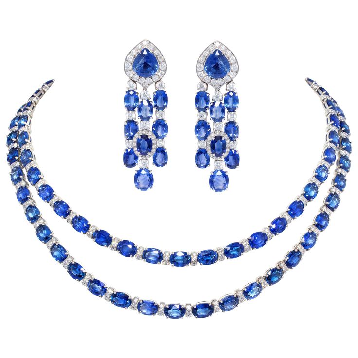 The blue sapphire and diamond necklace and earrings set features a total of 174.55 carats of oval cut and drop shape faceted Ceylon sapphires of homogeneous splendid color and crystalline texture. The design is complete with 10.90 carats of round diamonds of top quality (color, clarity and cut- F/VVS). The necklace consists of 2 necklaces nestling perfectly into each other. Each necklace displays an ideal level of flexibility, being shaped with a slight curve so as to fall perfectly around the n Blue Diamond Necklace, Blue Diamond Earrings, Sapphire Diamond Necklace, Necklace Displays, Blue Sapphire Jewelry, Necklaces Choker, Shiny Rings, Blue Sapphire Necklace, Vintage Choker