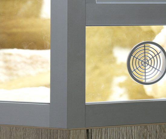 a close up view of a glass door with a circular design on it