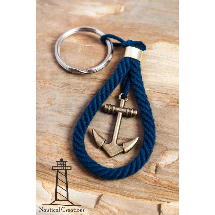 an anchor is hanging from a blue rope